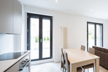 Open space with elegant kitchen and living room