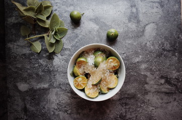 Healthy drink with fresh leaves, lemon, honey and sugar