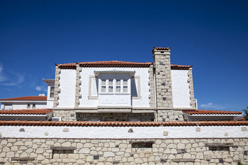 White stone house and blue sky
