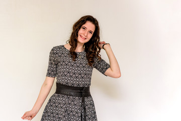beautiful young brunette girl on a white background in different poses