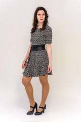 beautiful young brunette girl on a white background in different poses