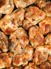 Pieces of roasted meat vertical background. Top view. Grill, lunch and dinner, culinary or food background. Set of chicken meat barbecue roasted seasoned, close-up, macro