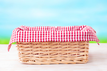 
Wicker basket on a wooden table