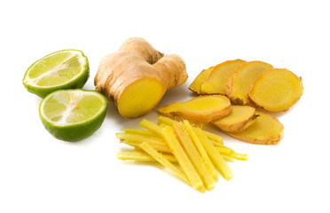 Ginger with a lime cut in half, isolated on white.