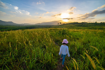 Fototapeta premium Girl with beautiful grass field