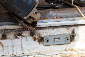 Cutting metal with angle grinder close-up