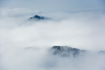 Mountain peaks in fog