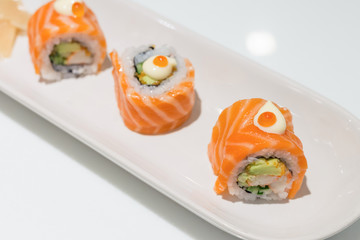 roll sushi with salmon In white plate