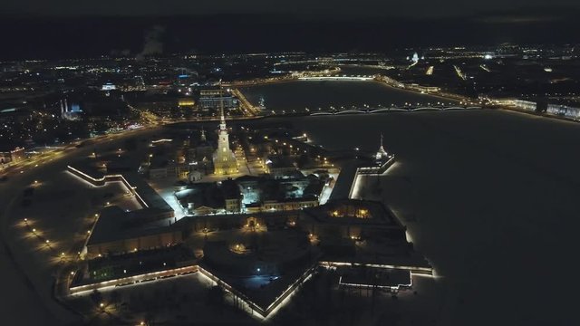  Fortress, top view. Extraordinary view of the lights, the bridge and the frozen Neva River in the city of St. Petersburg
