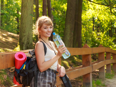 Tourist woman with backpack water bottle