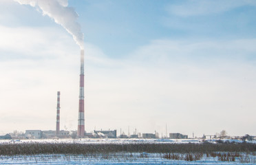 Obraz premium Smoke from the pipes of an industrial plant in the morning