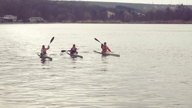 Young people canoeing in the lake