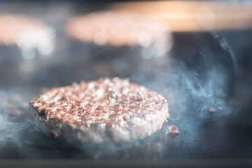 Hamburger cutlet frying on pan.Natural meet loaf pieces cooking in the kitchen.Burger sandwich meat...