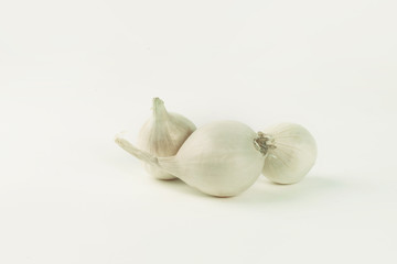 several heads of white onions .isolated on a white