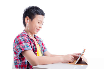 Young asian boy wearing headset and using tablet computer over white background