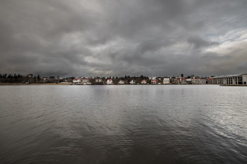 Lake of Reykjavik, Iceland in the center of the city a cloudy dark day.