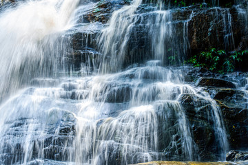 Fototapeta na wymiar Blue stream waterfall background