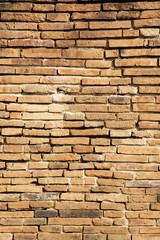 Vintage concept background of closeup old brick wall, vertical style