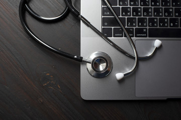 Close-up Of Medical Stethoscope On Laptop Keyboard