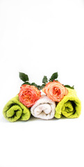 White and green roller towel with pink roses