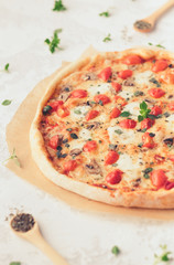 Margherita home made pizza with mushrooms on white table