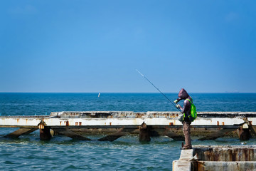 Leisure Activity, A Man Fishing at the Sea