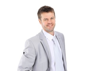 portrait of young businessman in a gray suit.