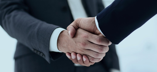 Obraz premium close up of two young male business partner shake hand