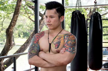 .Boxing men with floating tattoo show muscles.