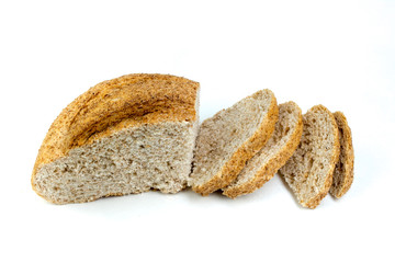 Many mixed breads and rolls of baked bread on isolated white background.