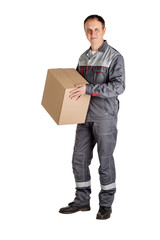 Male builder in a helmet with box and looking at camera over white wall background. repair, construction, building, people and maintenance concept.