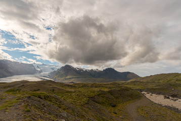 Travel to Iceland. Spectacular Icelandic landscape with road and scenic nature- fjords, fields, clouds. Driving the Ring Road in Southeast Iceland