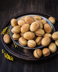 Traditional Russian dessert - nuts from short pastry with boiled condensed milk, caramel cream