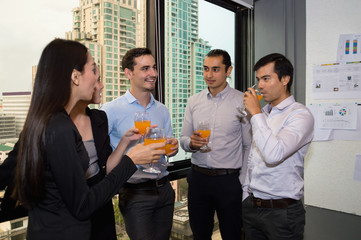 Youngs business people are celebrating success.