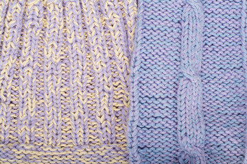 Sweater or scarf fabric texture large knitting. Knitted jersey background with a relief pattern. Braids in knitting . Wool hand- machine, handmade