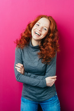 Young redhead woman with a vivacious smile