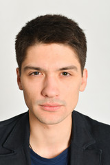 young man, guy emotionally posing in the studio - isolated