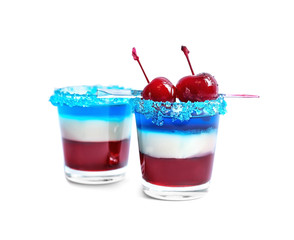 Layered cocktails in colors of American flag on white background