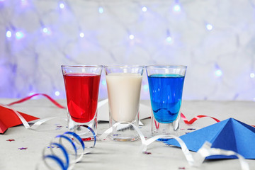 Cocktails in colors of American flag on table