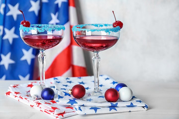 Layered cocktails in colors of American flag on table