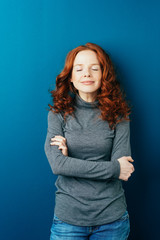 Happy serene young woman with a blissful smile