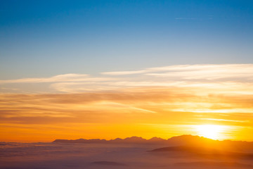 Fototapeta na wymiar Mountain silhouette at sundown
