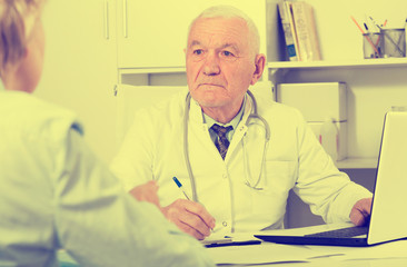 Male doctor with female client