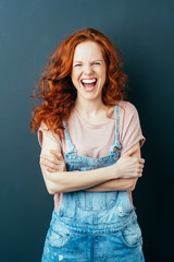 Vivacious confident young redhead woman