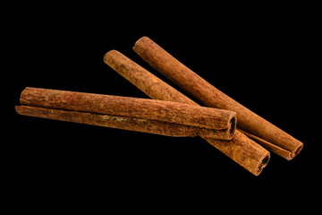 Cinnamon sticks isolated on black background