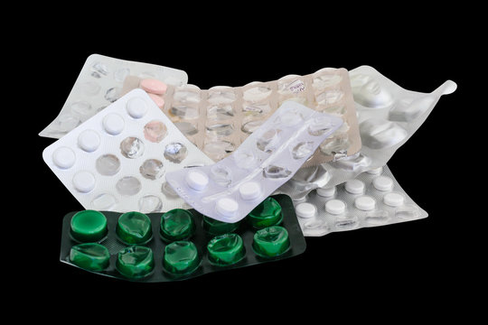 Tablets in a blister pack used medicine and drugs isolated on black