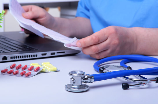 Close-up of stethoscope and pills. Healthcare, medical and pharmacy concept. Selective focus.