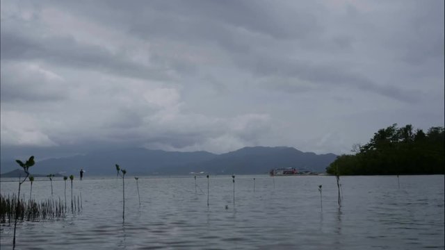 People crossing Double island at beaches, Port barton, Palawan, time lapse