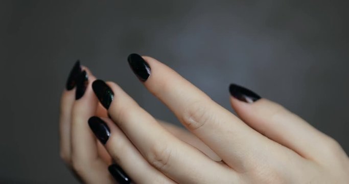 Nail design . Manicure nail paint . beautiful female hand with colorful nail art design manicure