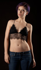 Fototapeta na wymiar Woman With Short Purple Hair in Jeans and a Lacy Bra